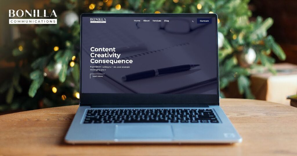 an image of a laptop computer on a tabletop with a website on the screen